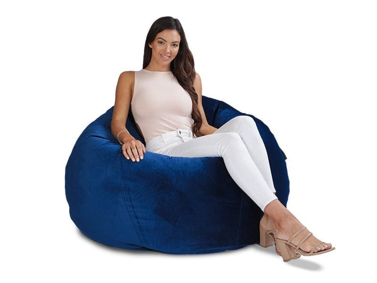 girl sitting on blue velvet beanbag