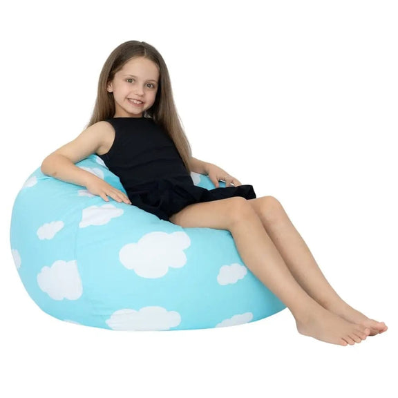 Child sitting on a blue bean bag with cloud pattern on a white background