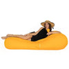 Woman lounging on a large orange Malibu outdoor bean bag lounger against a white background
